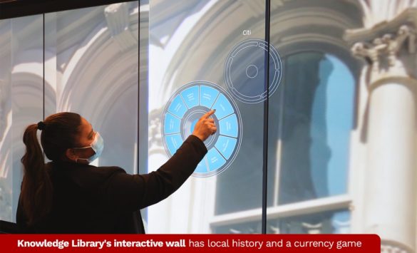 Knowledge library's interactive wall has local history and a currency game