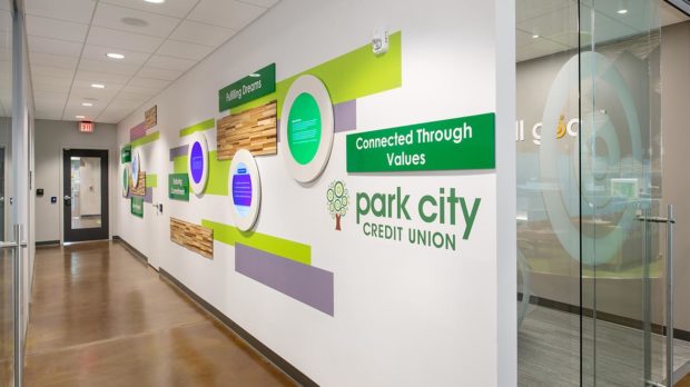 Interactive news walls engage members in the history of the credit union and the community strengthening their relationship with your brand